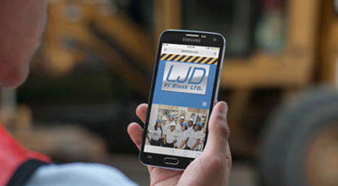 image of contractor viewing LJD VI Block's website on their mobile device